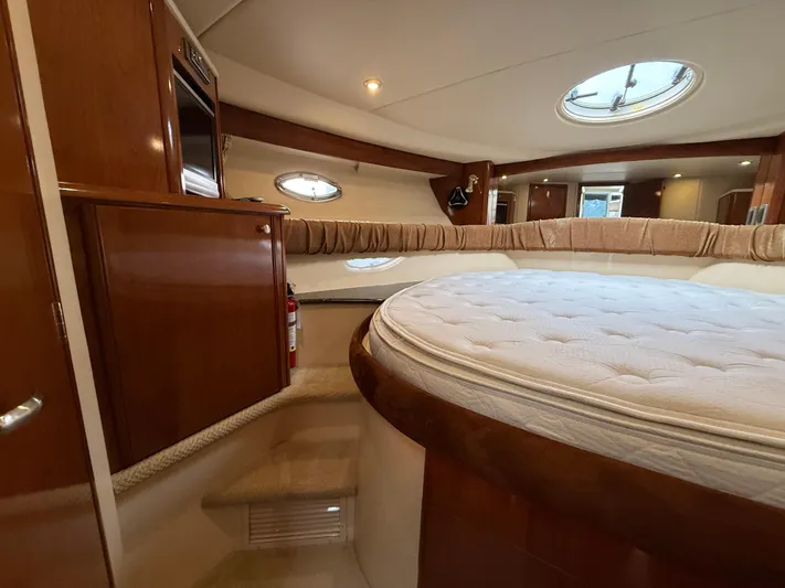 Diamonds Wild Yacht Photos Pics Interior of 2006 Meridian 411 Sedan yacht with luxurious bedroom and circular bed.