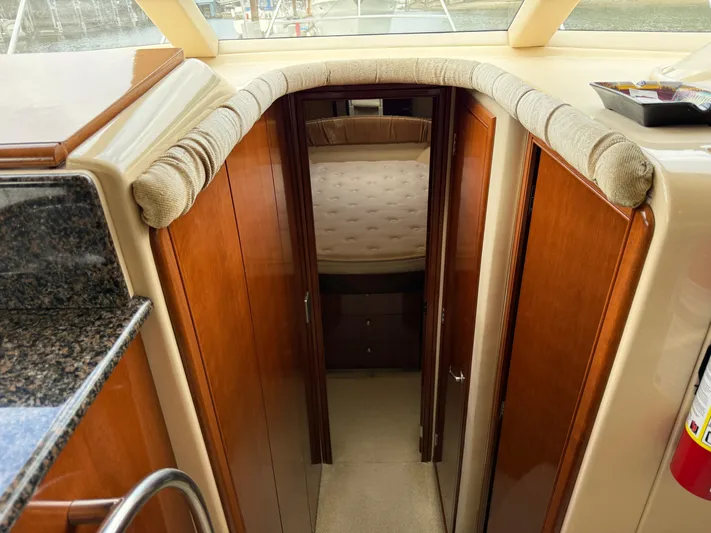 Diamonds Wild Yacht Photos Pics Interior view of a 2006 Meridian 411 Sedan yacht, featuring a cozy cabin entrance.