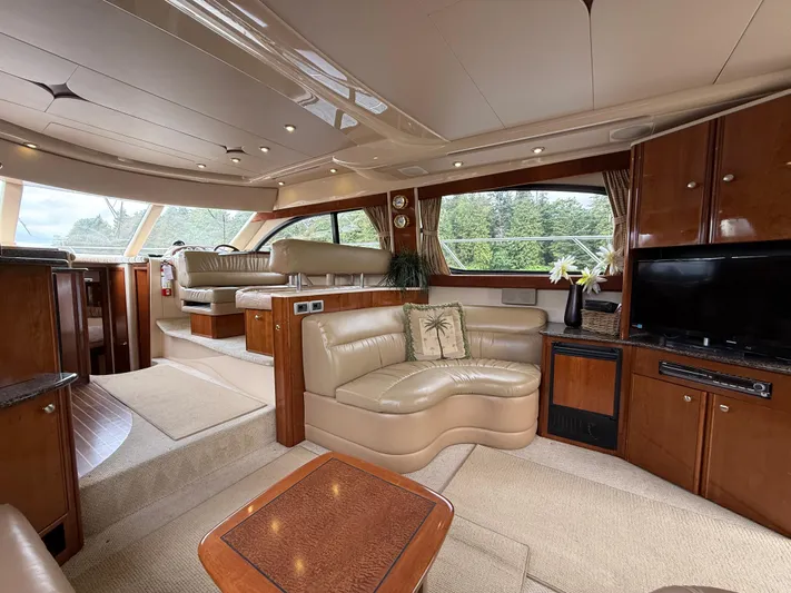 Diamonds Wild Yacht Photos Pics Luxurious interior of a 2006 Meridian 411 Sedan yacht with plush seating and elegant wood finishes.