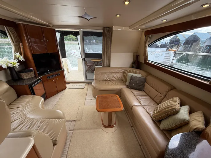 Diamonds Wild Yacht Photos Pics Luxurious interior of a 2006 Meridian 411 Sedan yacht with leather seating and elegant decor.