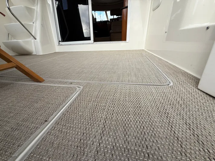 Diamonds Wild Yacht Photos Pics 2006 Meridian 411 Sedan interior with textured flooring and open cabin door.