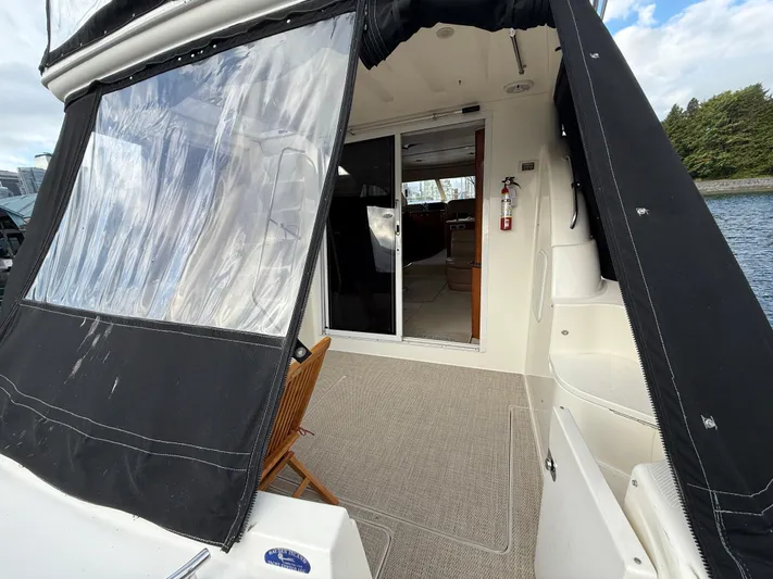 Diamonds Wild Yacht Photos Pics 2006 Meridian 411 Sedan yacht with covered deck and sliding glass doors.