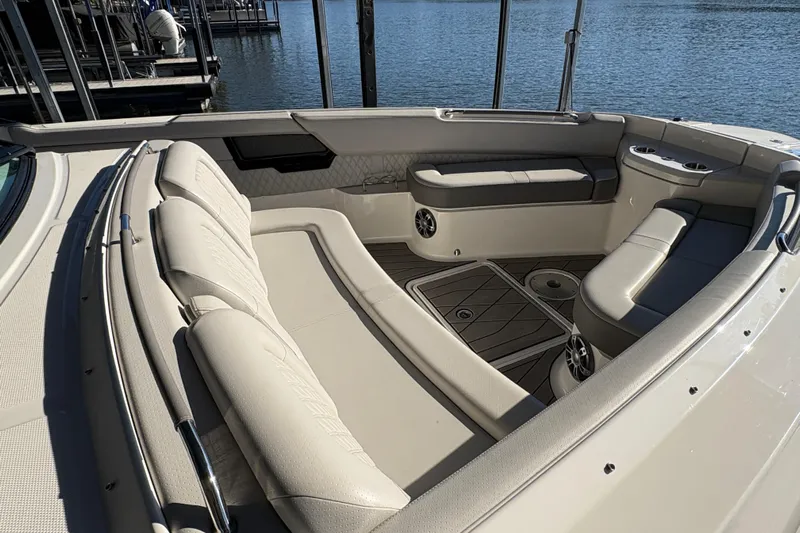  Yacht Photos Pics Luxurious seating area on 2023 Sea Ray SLX 400 boat, docked by the water.