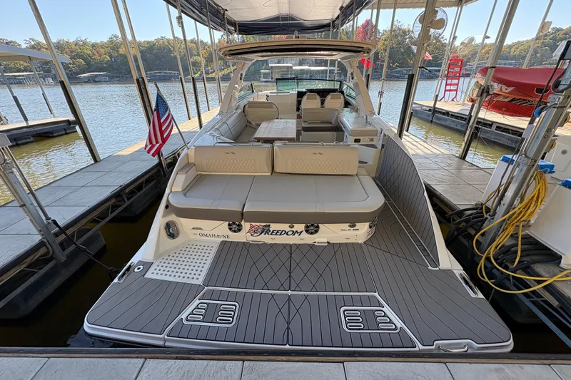  Yacht Photos Pics 2023 Sea Ray SLX 400 luxury boat docked, featuring spacious seating and sleek design.