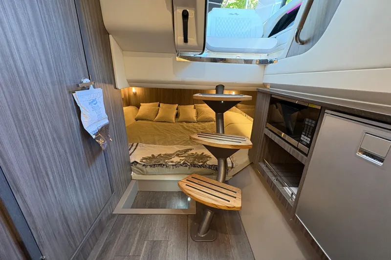  Yacht Photos Pics Interior of 2023 Sea Ray SLX 400 boat with cozy cabin and modern amenities.