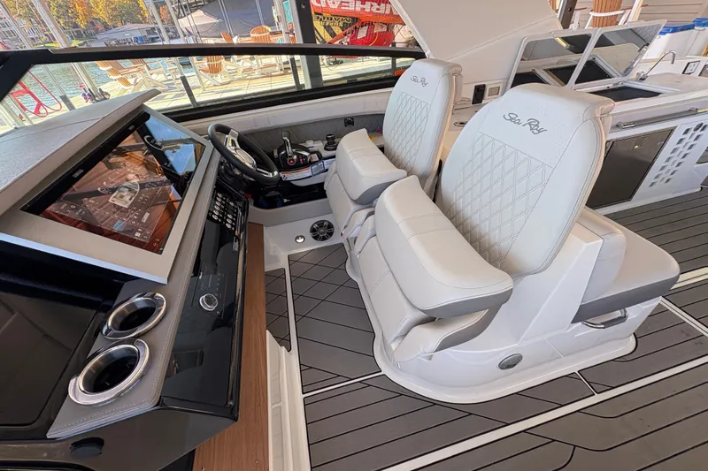  Yacht Photos Pics 2023 Sea Ray SLX 400 helm with luxurious seating and modern dashboard controls.