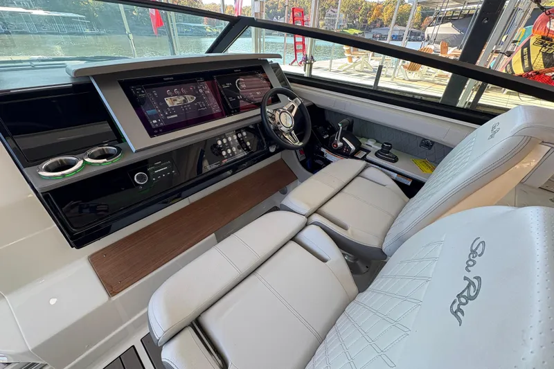  Yacht Photos Pics 2023 Sea Ray SLX 400 helm with modern controls and luxurious seating.