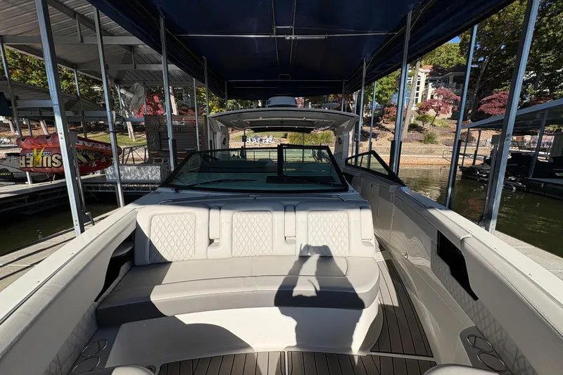  Yacht Photos Pics 2023 Sea Ray SLX 400 luxury boat interior at a marina dock.