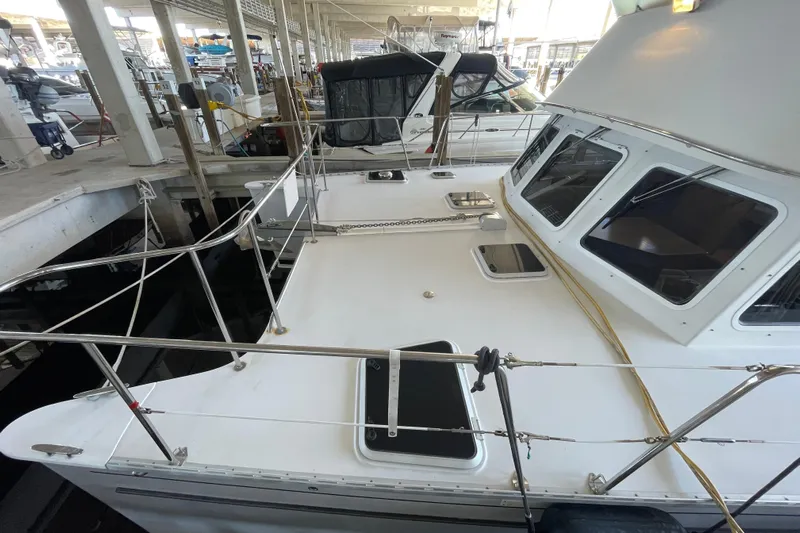 "new Hope" Yacht Photos Pics 2006 PDQ 34 Power Catamaran docked, showcasing spacious deck and sleek design.