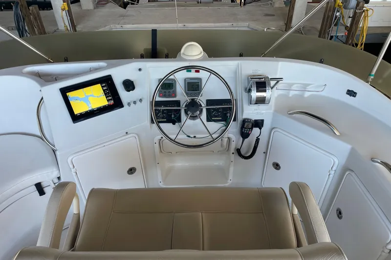 "new Hope" Yacht Photos Pics Helm of 2006 PDQ 34 Power Catamaran with navigation equipment and steering wheel.