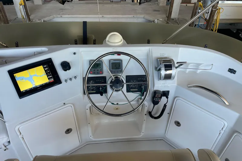 "new Hope" Yacht Photos Pics Control panel of 2006 PDQ 34 Power Catamaran with navigation screen and steering wheel.