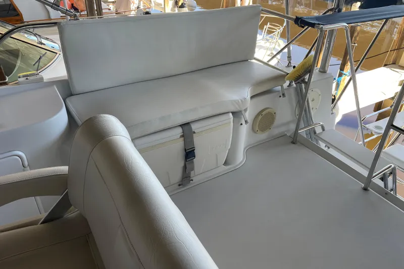"new Hope" Yacht Photos Pics 2006 PDQ 34 Power Catamaran interior with cushioned seating and storage.