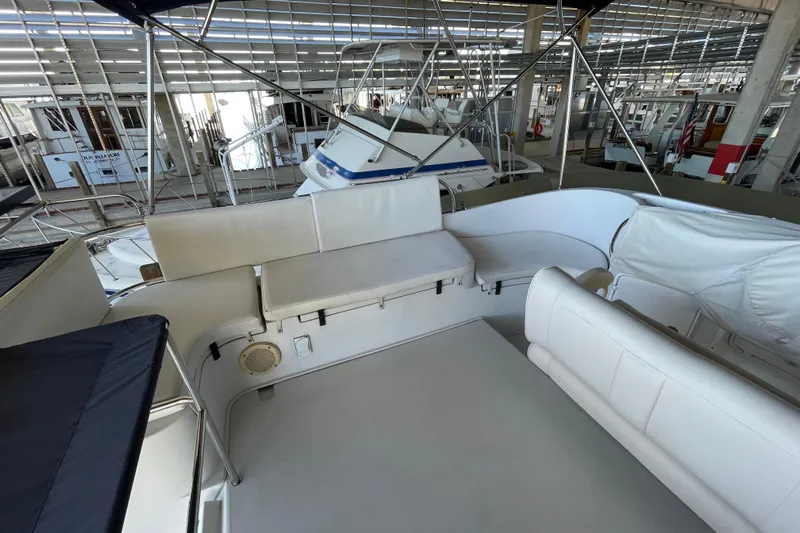 "new Hope" Yacht Photos Pics 2006 PDQ 34 Power Catamaran interior with white seating in a marina setting.