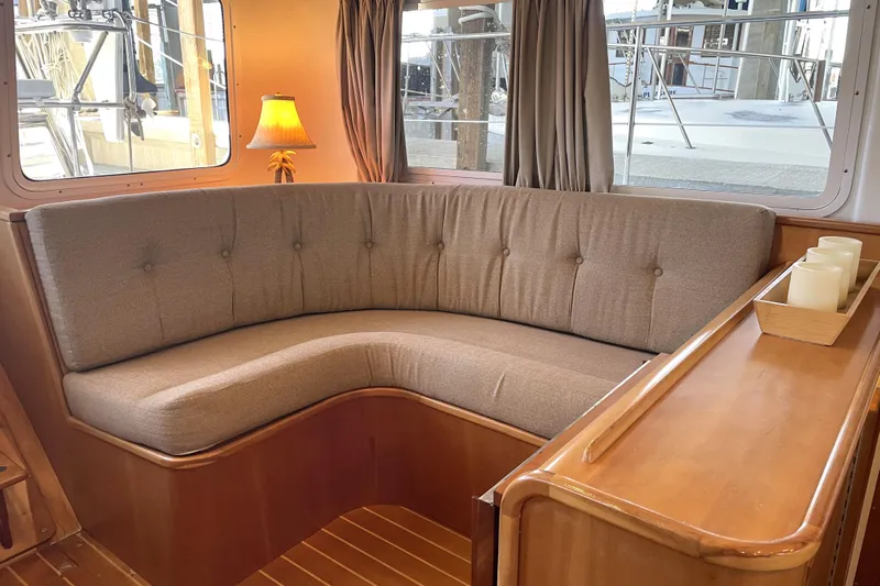 "new Hope" Yacht Photos Pics Cozy interior of 2006 PDQ 34 Power Catamaran with cushioned seating and ambient lighting.