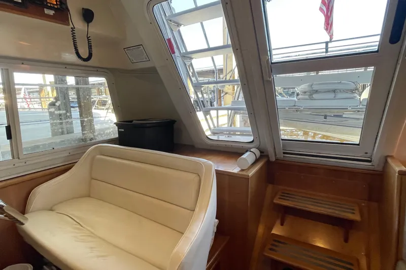 "new Hope" Yacht Photos Pics Interior of 2006 PDQ 34 Power Catamaran with seating and window view.