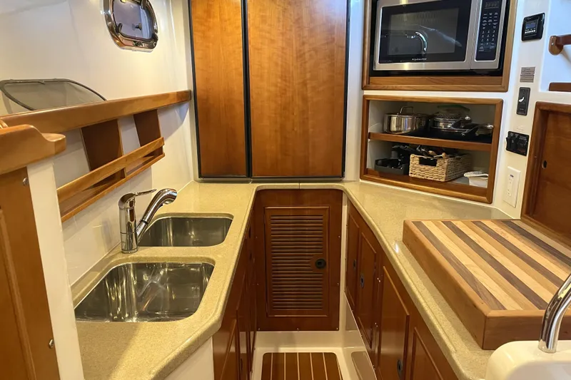 "new Hope" Yacht Photos Pics Galley kitchen in 2006 PDQ 34 Power Catamaran with dual sinks and microwave.