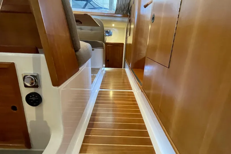 "new Hope" Yacht Photos Pics Interior view of 2006 PDQ 34 Power Catamaran with wooden flooring and seating.