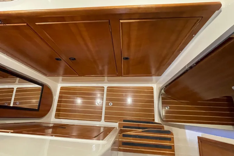 "new Hope" Yacht Photos Pics Interior of 2006 PDQ 34 Power Catamaran with wooden cabinetry and steps.