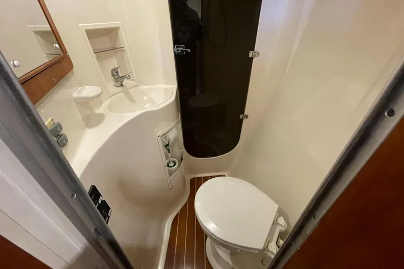 "new Hope" Yacht Photos Pics Bathroom interior of 2006 PDQ 34 Power Catamaran with toilet and sink.