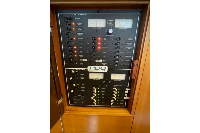 "new Hope" Yacht Photos Pics Electrical control panel on a 2006 PDQ 34 Power Catamaran, featuring various switches and gauges.