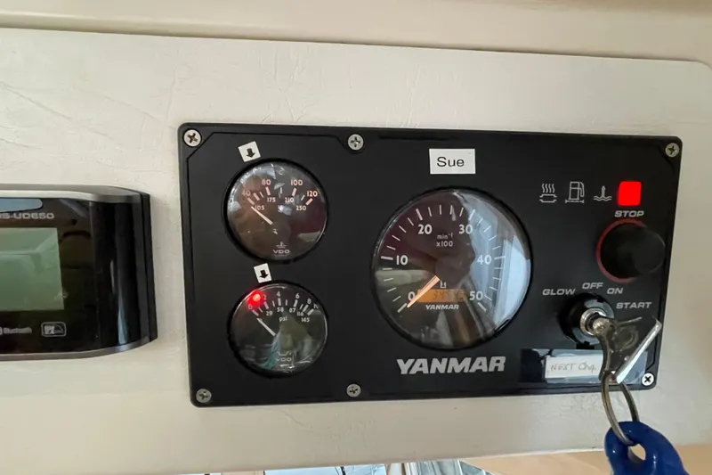 "new Hope" Yacht Photos Pics Control panel of a 2006 PDQ 34 Power Catamaran with Yanmar gauges and key ignition.