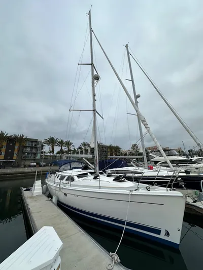 Lanikai Yacht Photos Pics 2007 Hunter 44 Deck Salon sailboat docked at marina under cloudy sky.