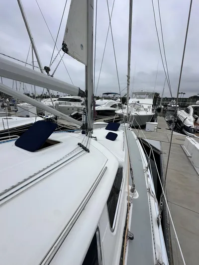 Lanikai Yacht Photos Pics 2007 Hunter 44 Deck Salon sailboat docked in marina, overcast sky.