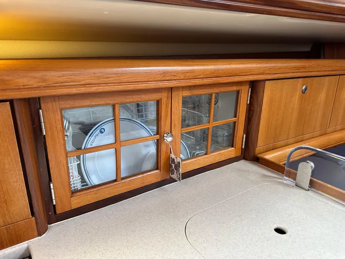 Lanikai Yacht Photos Pics Wooden cabinet with glass doors in 2007 Hunter 44 Deck Salon yacht kitchen.