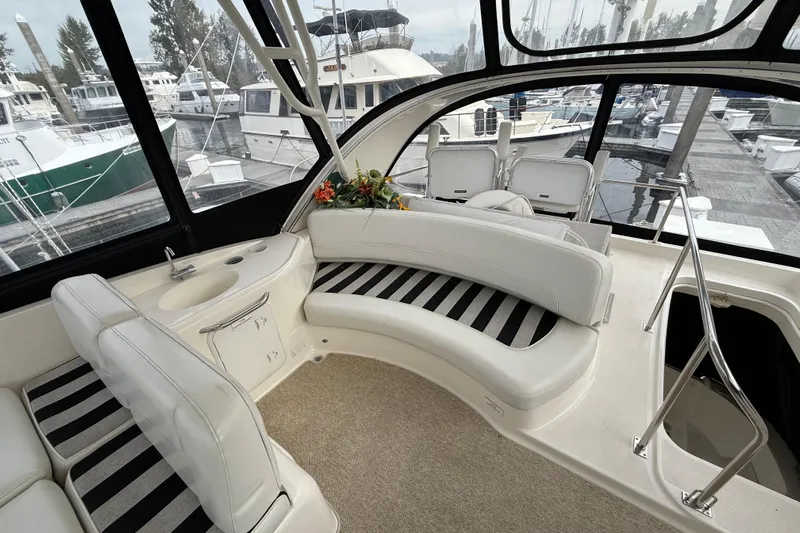  Yacht Photos Pics Luxurious 2007 Meridian 411 Sedan yacht interior with plush seating and marina view.