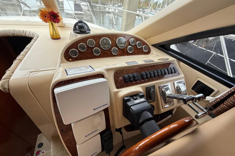  Yacht Photos Pics 2007 Meridian 411 Sedan helm with gauges, controls, and Northstar navigation system.