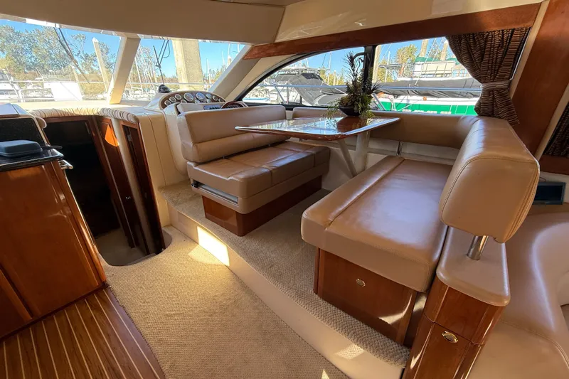  Yacht Photos Pics Luxurious interior of 2007 Meridian 411 Sedan yacht with plush seating and elegant table.
