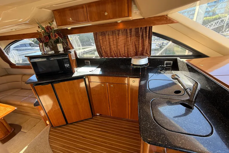  Yacht Photos Pics Luxurious 2007 Meridian 411 Sedan yacht interior with modern kitchen amenities.