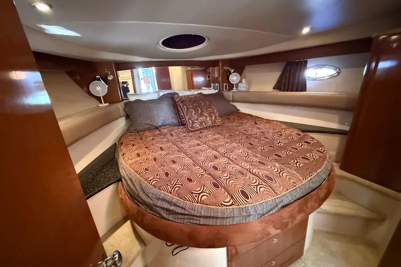  Yacht Photos Pics Luxurious bedroom interior of 2007 Meridian 411 Sedan yacht with elegant bedding.