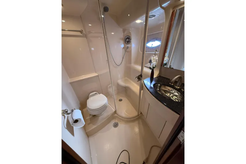  Yacht Photos Pics Luxurious bathroom in 2007 Meridian 411 Sedan yacht with shower and sink.