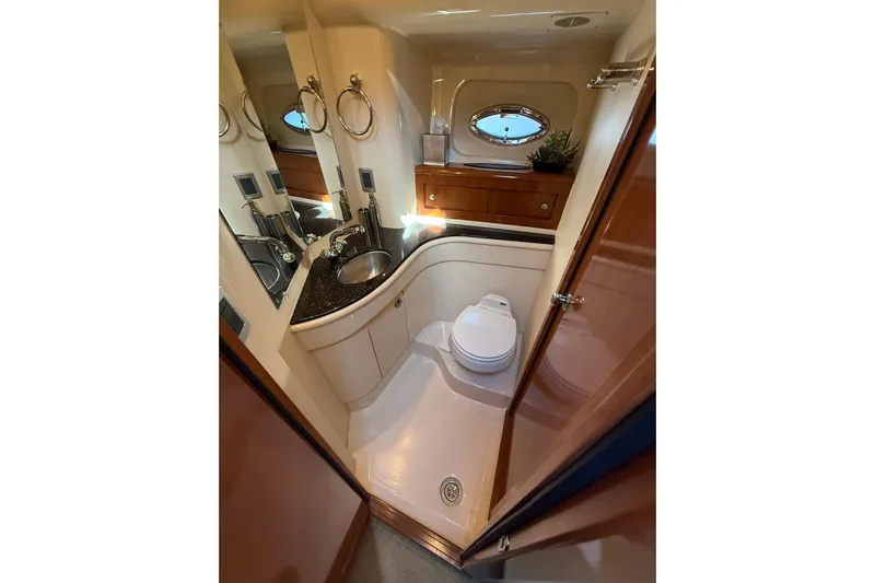  Yacht Photos Pics Luxurious bathroom in 2007 Meridian 411 Sedan yacht with modern fixtures and elegant design.