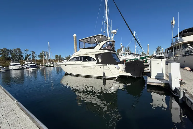  Yacht Photos Pics 2007 Meridian 411 Sedan yacht docked in a marina under clear blue skies.