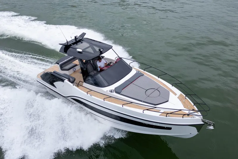  Yacht Photos Pics 2026 GRAND OCEAN 37 yacht cruising on open water, showcasing sleek design and luxury.