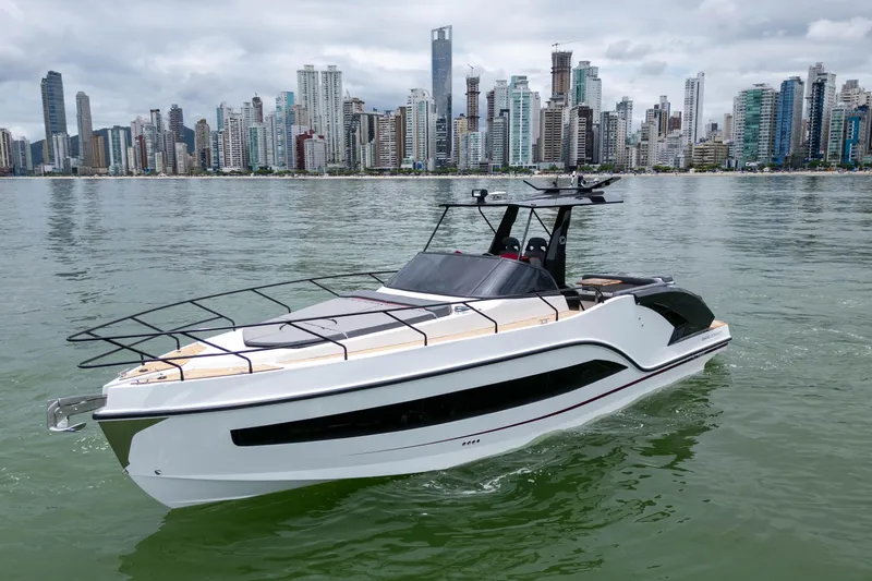  Yacht Photos Pics Luxury GRAND OCEAN 37 yacht cruising near a city skyline, 2026 model.