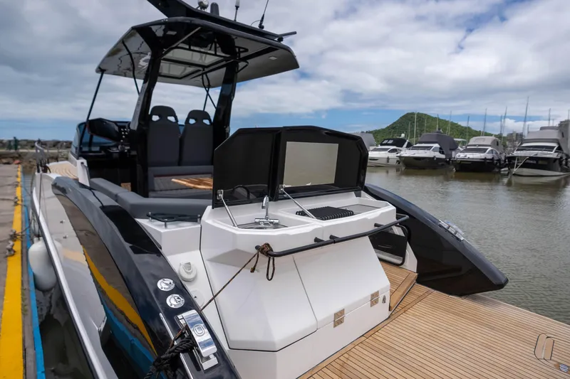  Yacht Photos Pics 2026 GRAND OCEAN 37 yacht docked, featuring sleek design and modern amenities.