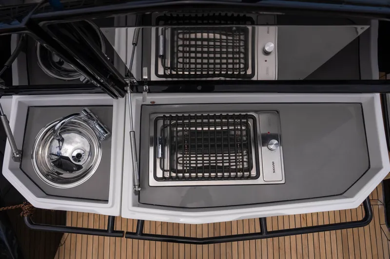  Yacht Photos Pics Outdoor kitchen setup on a 2026 GRAND OCEAN 37 yacht, featuring a sink and grill.