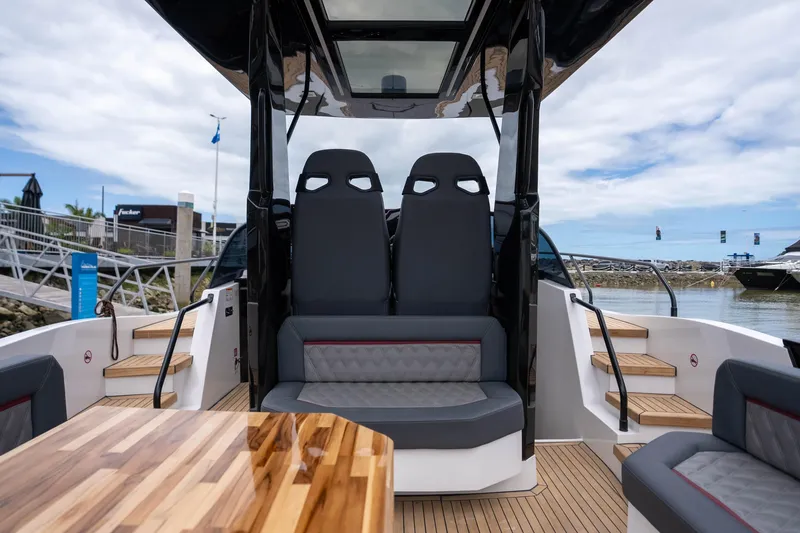  Yacht Photos Pics Luxury interior of 2026 GRAND OCEAN 37 yacht with modern seating and wooden accents.