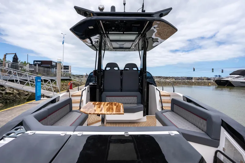  Yacht Photos Pics 2026 GRAND OCEAN 37 boat interior with modern seating and wooden table.