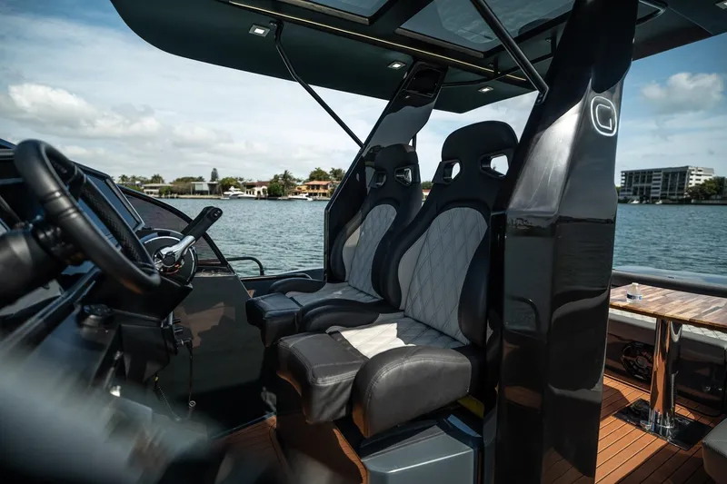  Yacht Photos Pics Luxury seating on 2026 GRAND OCEAN 37 yacht, overlooking serene waterfront.