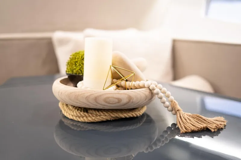  Yacht Photos Pics Decorative centerpiece on a GRAND OCEAN 37 yacht, featuring candle, beads, and rope.