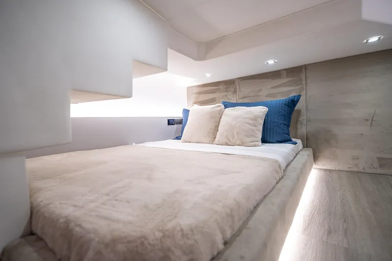  Yacht Photos Pics Luxurious bedroom interior in 2026 GRAND OCEAN 37 yacht, featuring modern design and cozy bedding.
