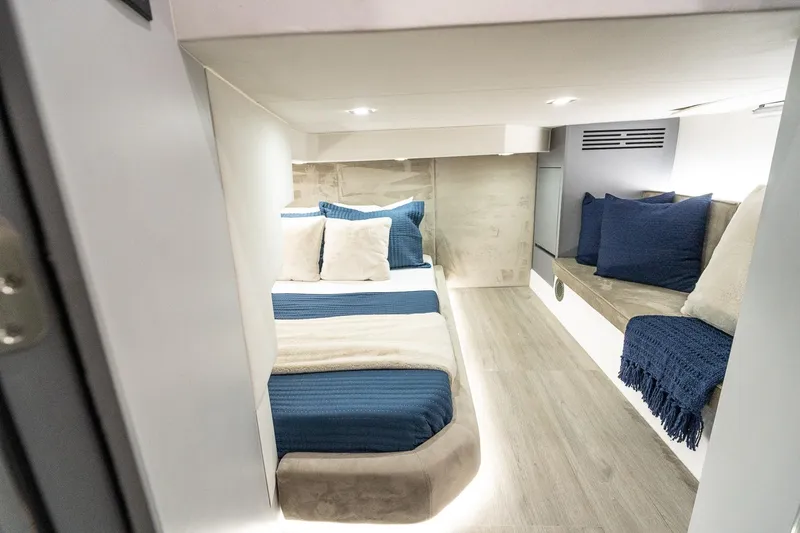  Yacht Photos Pics Luxurious cabin interior of 2026 GRAND OCEAN 37 yacht with cozy bedding and seating.