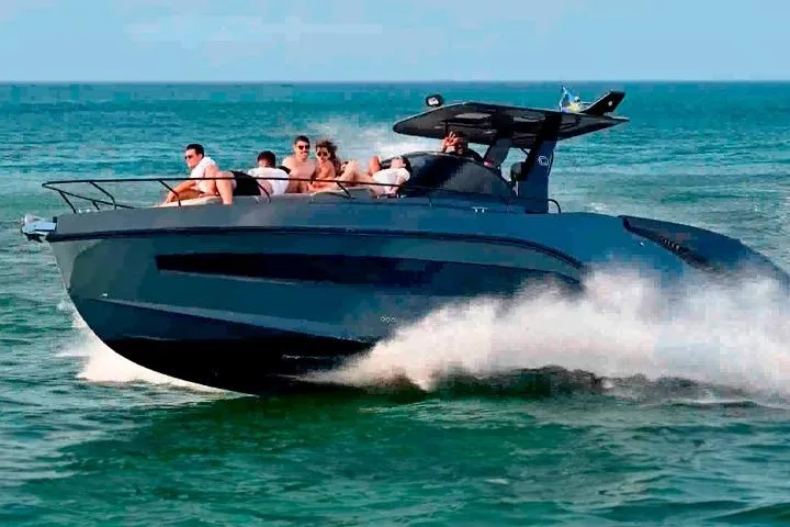  Yacht Photos Pics 2026 GRAND OCEAN 37 boat cruising on open water with passengers enjoying the ride.