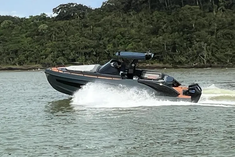  Yacht Photos Pics 2026 GRAND OCEAN 37 boat cruising on a scenic river with lush greenery.