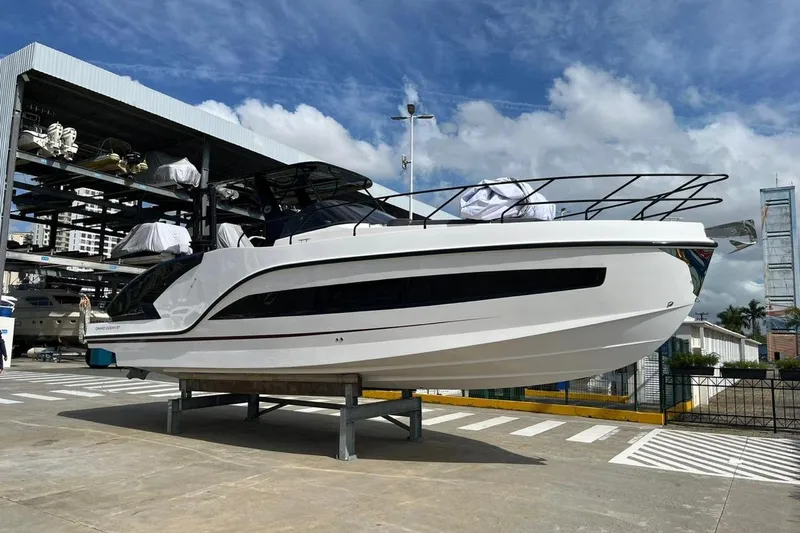  Yacht Photos Pics 2026 GRAND OCEAN 37 yacht displayed on a stand under a partly cloudy sky.