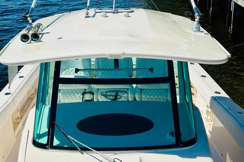 The Office Yacht Photos Pics 2012 Grady-White Canyon 366 boat with a spacious deck and modern design.